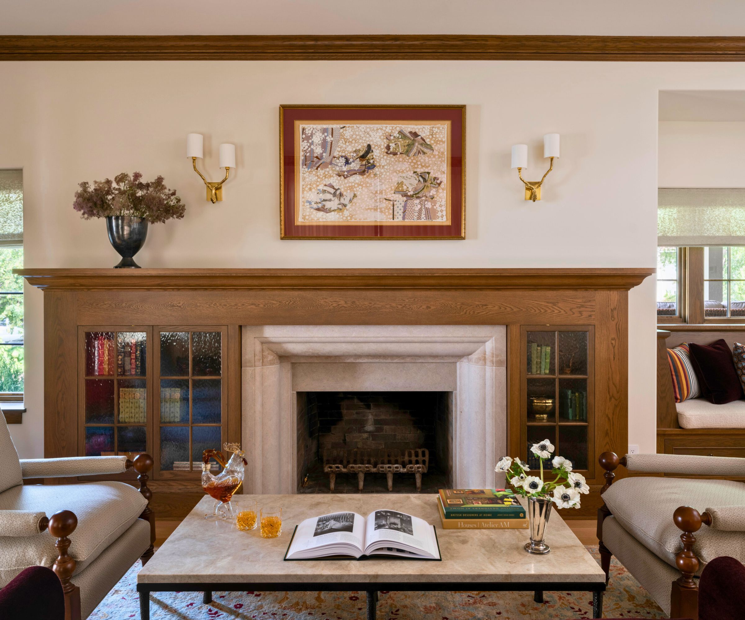 living room with built-in bookcases round fireplace