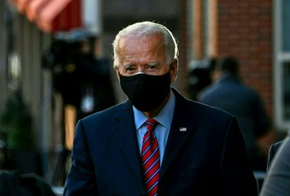 Biden walks with a mask on