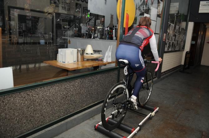 Hayley Jones of Great Britain warms up in a shop doorway