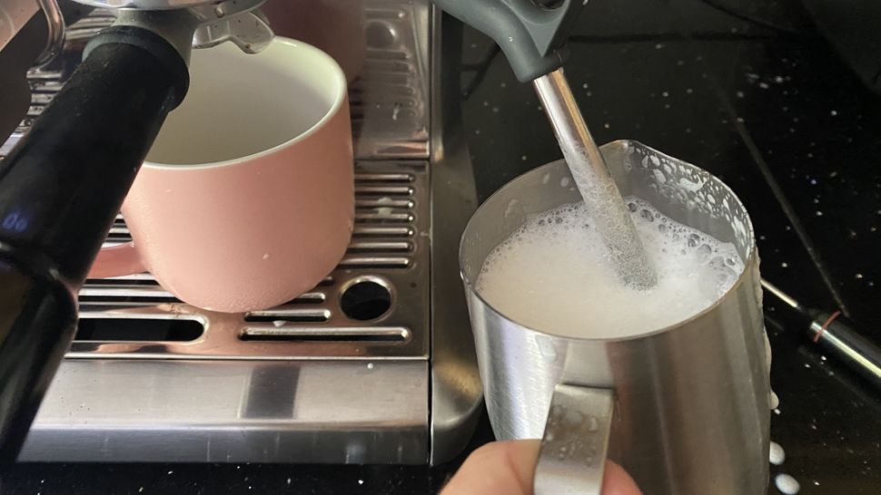 Steaming milk using Sage the Barista Express Impress coffee maker