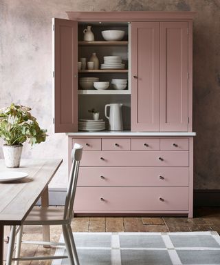 kitchen unit, dining table and rug