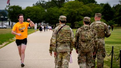 Jogger in Washington, D.C., tells National Guard troops they should be patrolling a crime-ridden area of the city