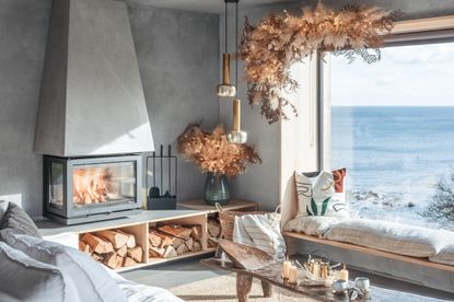 Christmas window decor in Scandi style living room by Unique Homestays