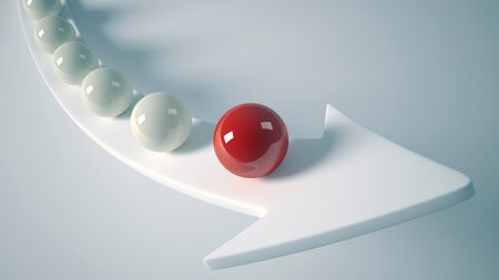 A line of white balls leading to one red ball, all balanced on a white arrow