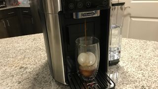 De'Longhi TrueBrew pouring an iced espresso