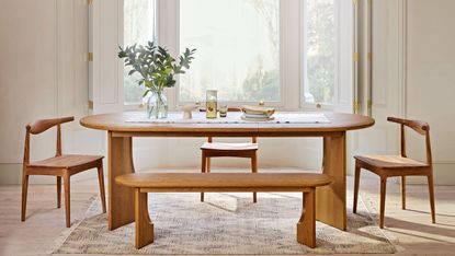 Neutral living room with wooden table and chairs