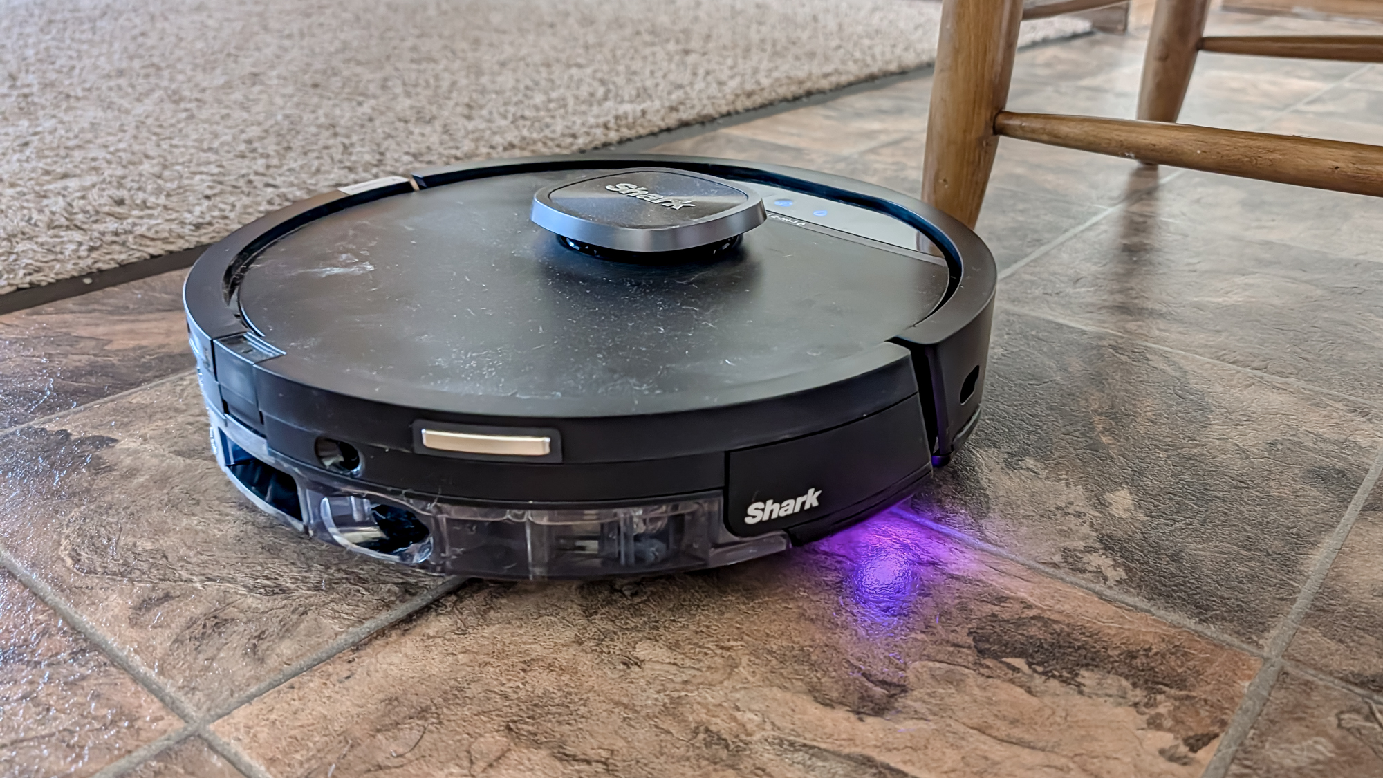 Shark UV Reveal PowerDetect Robot Vacuum on a kitchen floor