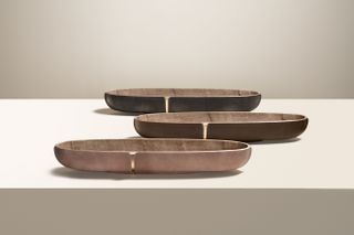 Three metal trays with oblong forms