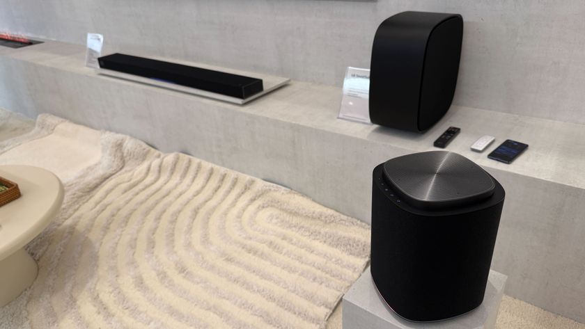 LG soundbar, subwoofer and surround speaker in a modern living room environment