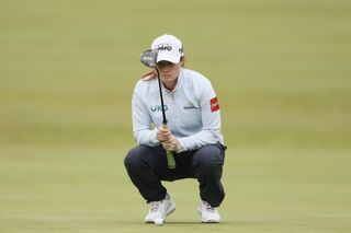 Leona Maguire lines up a putt