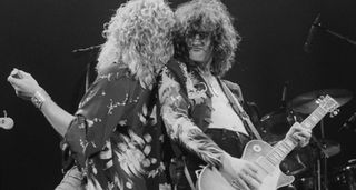 Robert Plant and Jimmy Page back to back onstage at Earl's Court.