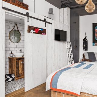 double bed bedroom with wooden flooring