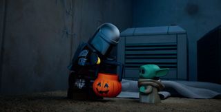 a lego figurine in armor peers into a jack-o-lantern-shaped bucket