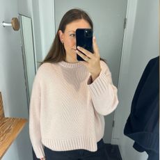 An image of Who What Wear's Poppy Nash wearing a cashmere jumper.