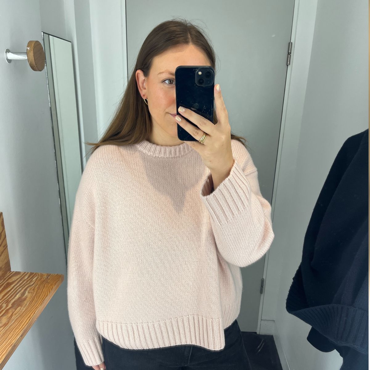 An image ofBest Knockoff Luxury Clothing
's Poppy Nash wearing a cashmere jumper.