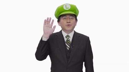 Former Nintendo president Satoru Iwata in a Luigi hat