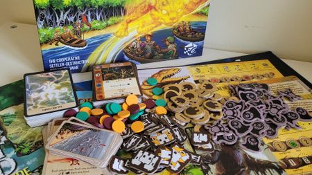 The box, board, cards, and scattered tokens of Horizons of Spirit Island on a white table