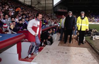 LIVERPOOL, ENGLAND - APRIL 20: New Liverpool manager Graeme Souness emerges from the Tunnel as the Police and crowd look ahead of his first match in charge, a First Division match against Norwich City at Anfield on April 20th, 1991 in Liverpool, England. (Photo by Daniel Smith/Allsport/Getty Images/Hulton Archive)