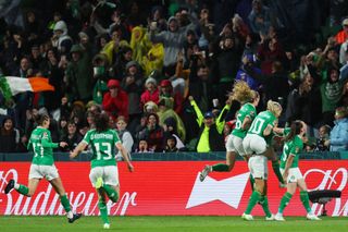 Republic of Ireland players celebrate the team's first goal scored by Katie McCabe (obscured) during the FIFA Women's World Cup Australia & New Zealand 2023 Group B match between Canada and Ireland at Perth Rectangular Stadium on July 26, 2023 in Perth, Australia.