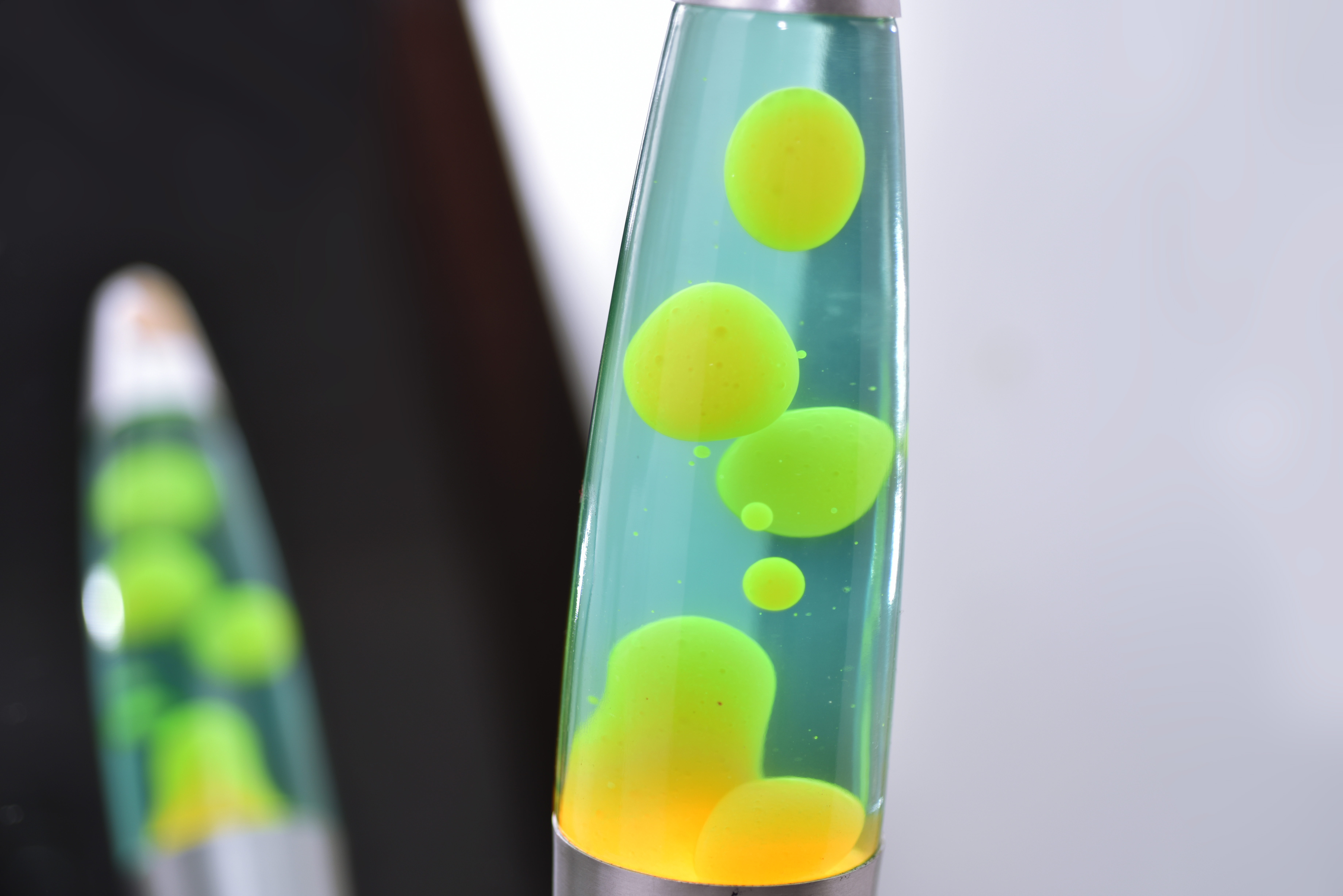 Lava lamp with green and yellow light, one of the things to do with kids