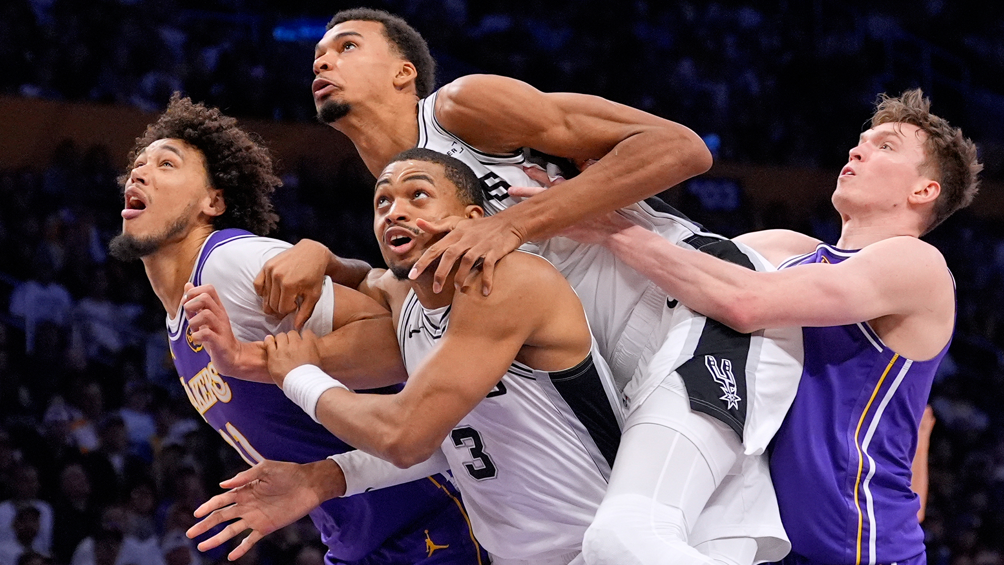 Los Angeles Lakers and San Antonio Spurs players compete during an NBA basketball game in Los Angeles, California