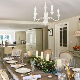 kitchen dining area with dining table and candles