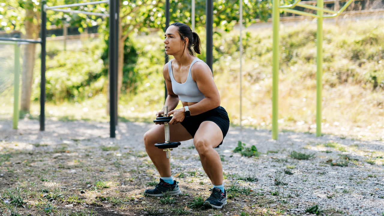 Woman doing single dumbbell workout