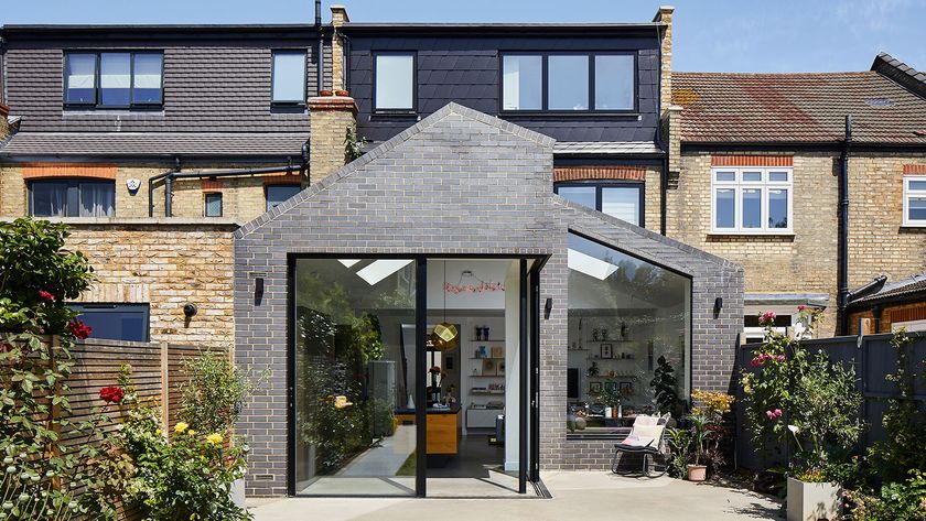 brick-clad rear extension with large sliding doors and a loft conversion