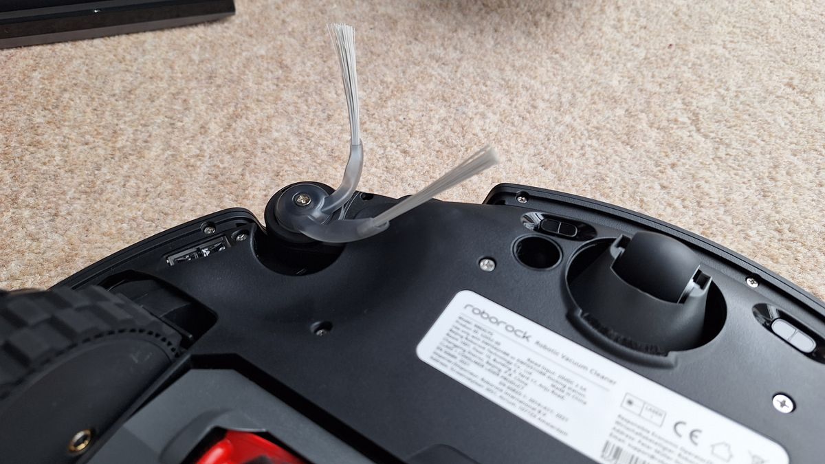 Roborock Saros 20 robot vacuum flipped over to show side sweeper