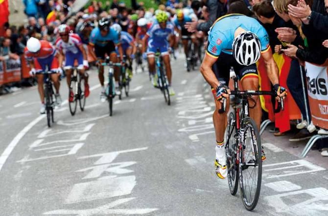 Head down: The moment Gilbert (Belgium) danced away from the best riders in the world to win his first rainbow jersey.
