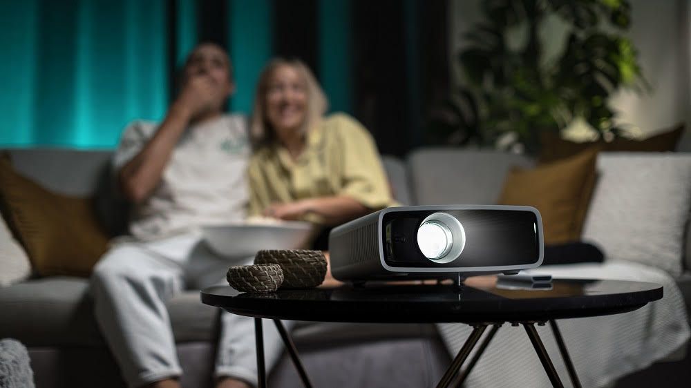 Philips NeoPix 750 Smart projector lifestyle shot in lounge