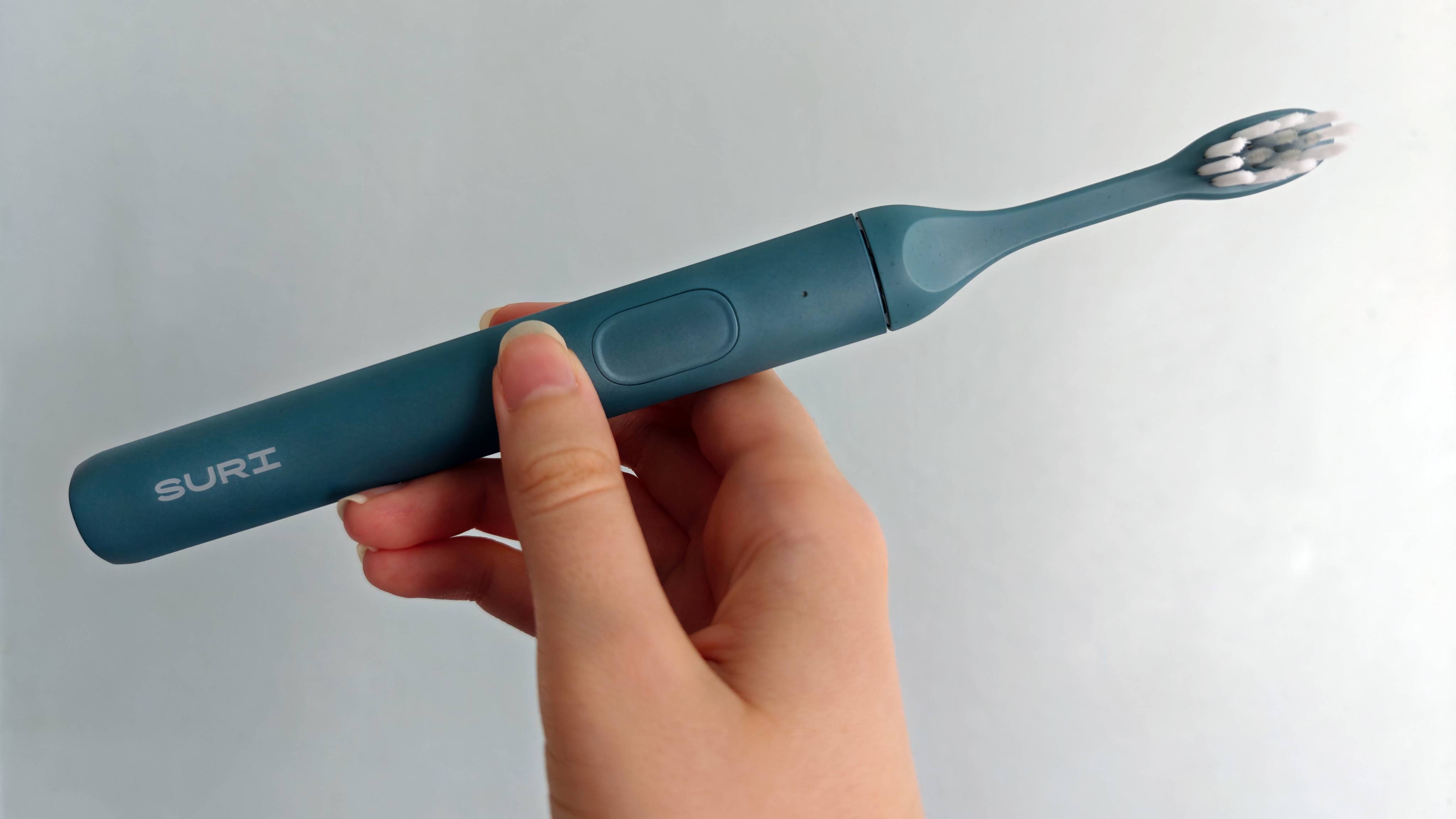Suri 2.0 Electric Toothbrush in hand