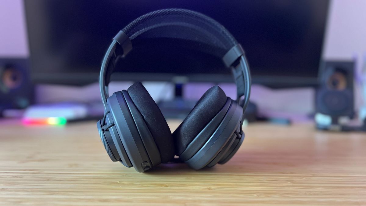 Turtle Beach Atlas Air gaming headset on a wooden desk in front of a PC setup