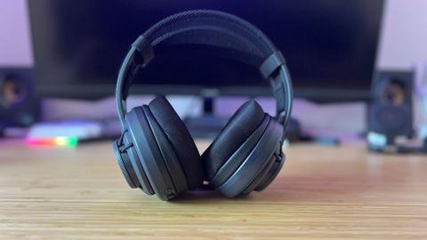 Turtle Beach Atlas Air gaming headset on a wooden desk in front of a PC setup