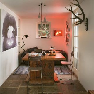 dining area with white walls and arts