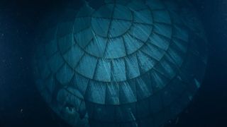 A view of the Artemis 2 Orion heat shield underwater. The heat shield appears as different shades of dark blue.