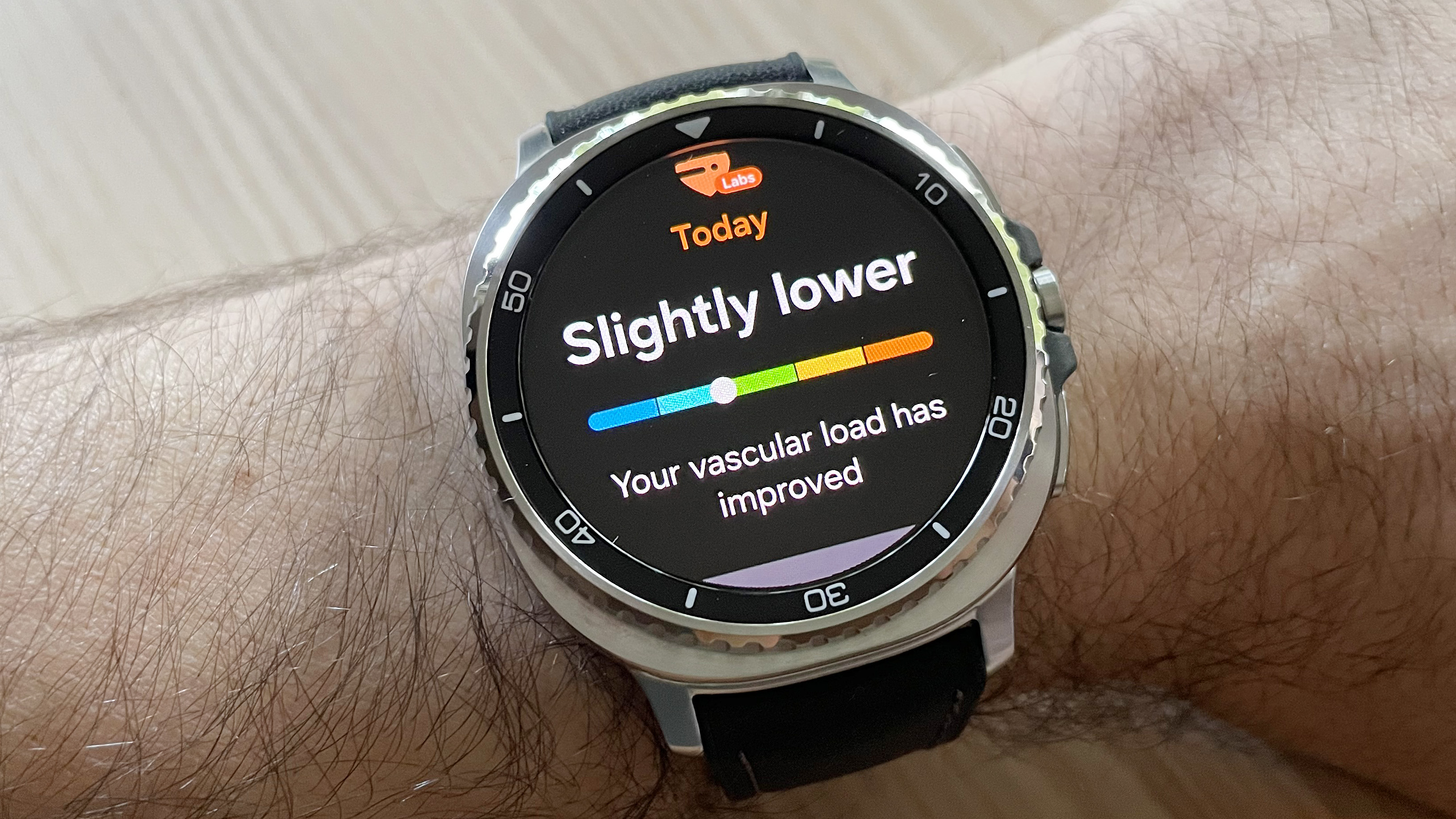 Close-up of the Samsung Galaxy Watch 8 Classic in silver on a black strap with the Vascular Load feature shown