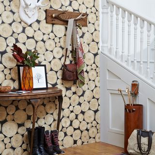 hallway with wood effect wallpaper and white stairway