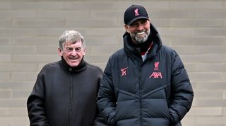 Sir Kenny Dalglish watches a Liverpool training session with Jurgen Klopp in February 2023.