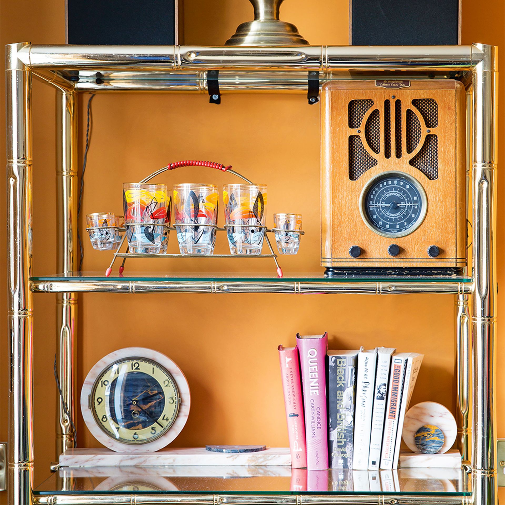 orange living room with gold shelf