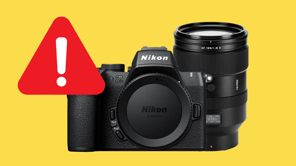 Nikon Z camera with a lens, overlaid with a red warning symbol on a bright yellow background
