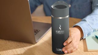 Ninja Sip Perfect travel mug on a desk