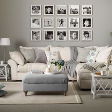 living room with photo frame and sofa with cushion