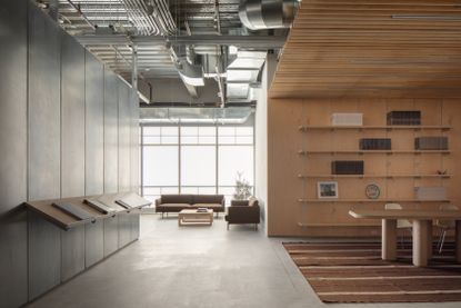 minimalist interior of artist Glenn Ligon's studio by Ravi Raj, with artworks and bespoke utilitarian furniture