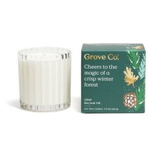 Fir scented candle next to box from Grove Collaborative