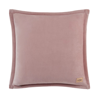 A blush pink velvet throw pillow by UGG