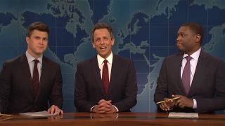 Colin Jost, then Seth Meyers, the Michael Che sitting at the weekend update desk with its map background.