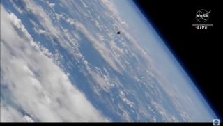 A Russian Soyuz spacecraft carrying three cosmonauts approaches the International Space Station on March 18, 2022.