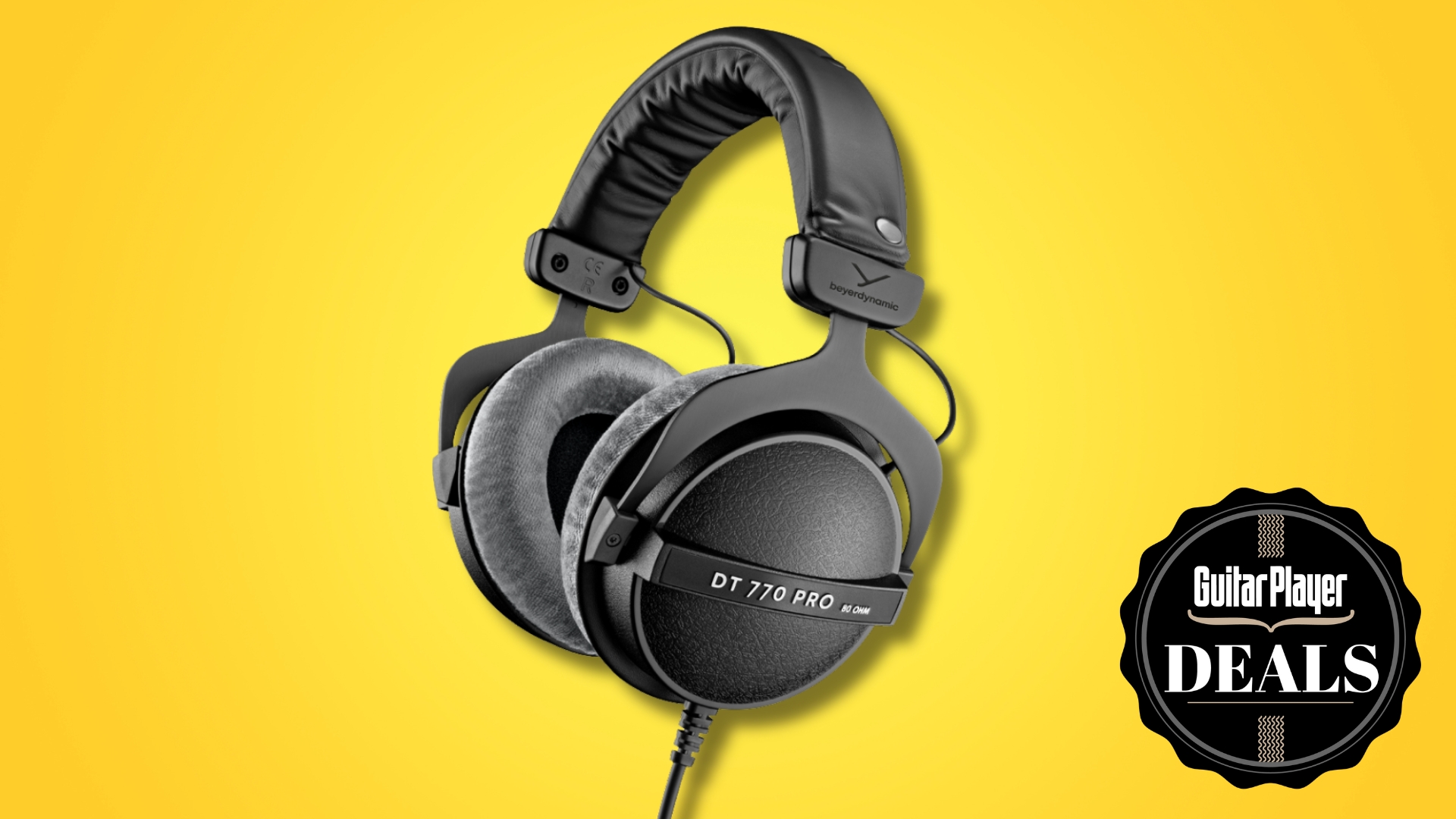A pair of Beyerdynamic DT 770 Pro studio headphones on a yellow background