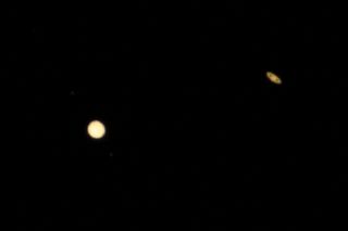 An image shows Jupiter and Saturn in the sky on Dec. 21 during the "Great Conjunction" event.